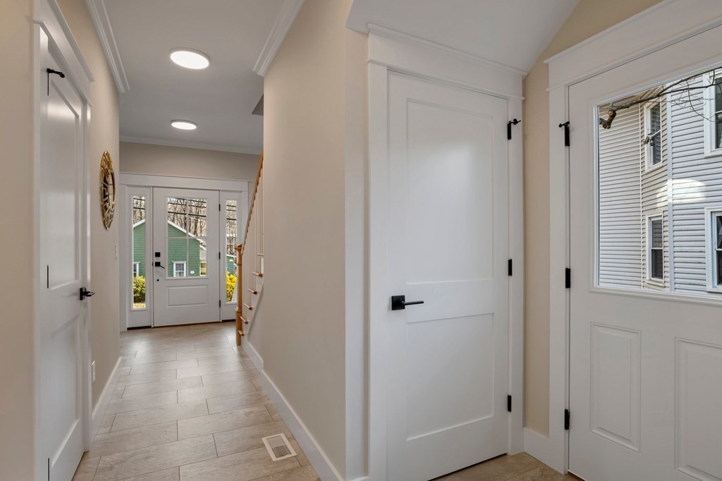 297 Riverside Drive Northampton, MA 01062 - Photo 16 of 32 a view of a hallway with a livingroom and a livingroom with furniture