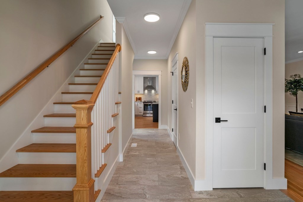 297 Riverside Drive Northampton, MA 01062 - Photo 17 of 32 a view of a hallway with white walls and stairs