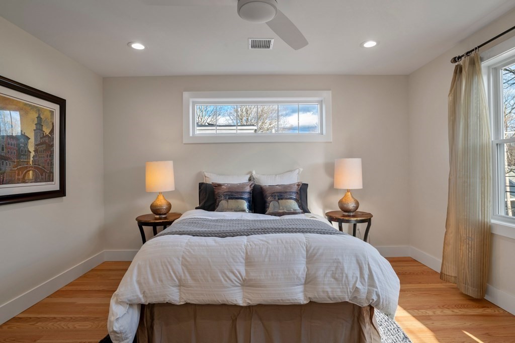 297 Riverside Drive Northampton, MA 01062 - Photo 22 of 32 a bedroom with a bed and wooden floor