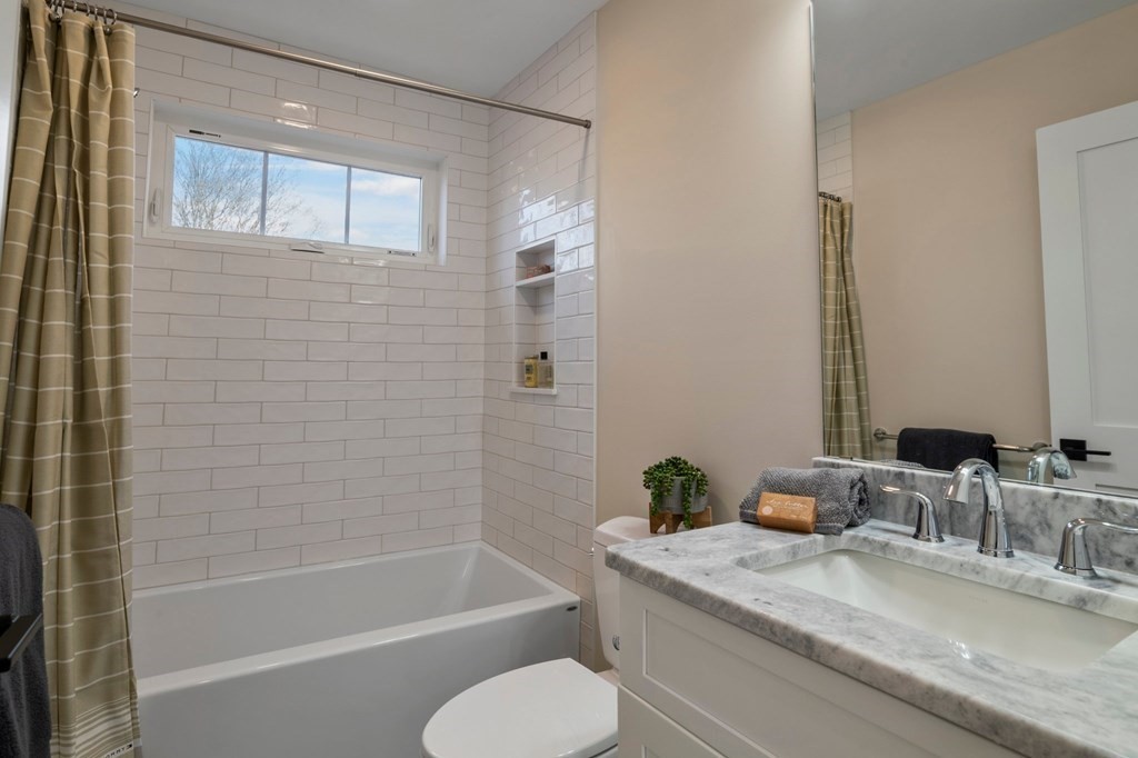 297 Riverside Drive Northampton, MA 01062 - Photo 30 of 32 a bathroom with a granite countertop sink toilet and shower