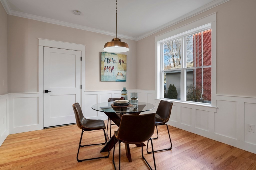 297 Riverside Drive Northampton, MA 01062 - Photo 8 of 32 a dining room with furniture a rug and wooden floor