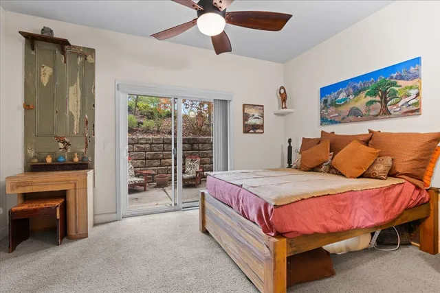 a spacious bedroom with a bed and a fireplace