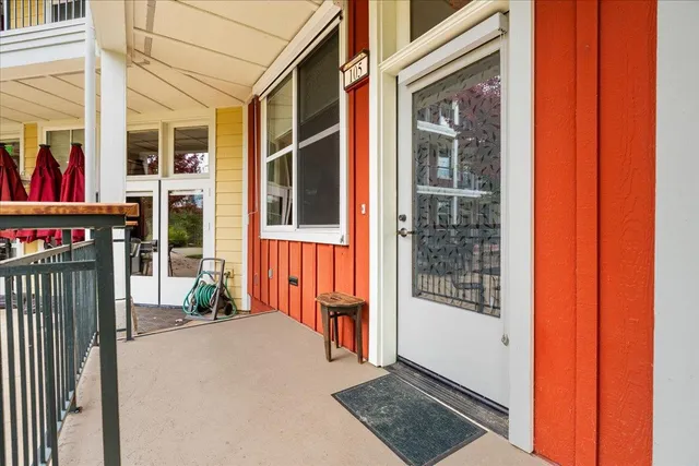 a view of a building with a door and windows