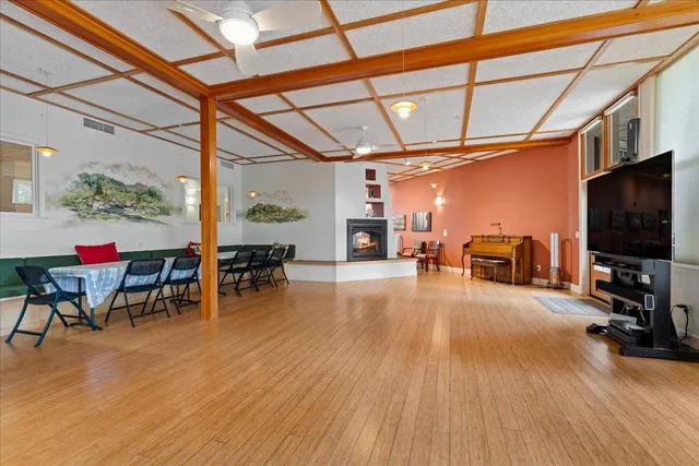 a view of a livingroom with furniture and a flat screen tv