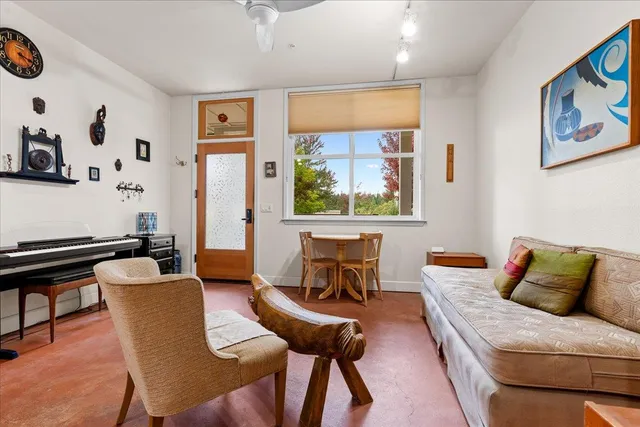 a living room with furniture and a window