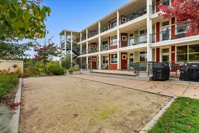 a front view of a building with garden