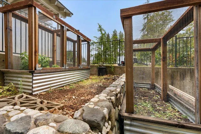 a view of a porch with furniture and a yard