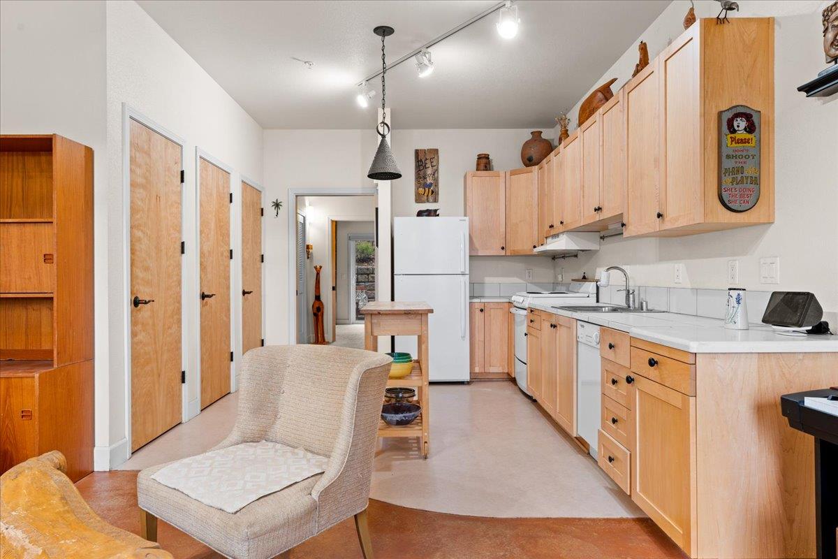 800 Freeman Lane, Unit 105 Grass Valley, CA 95949 - Photo 6 of 48 a large white kitchen with a refrigerator a sink and a stove