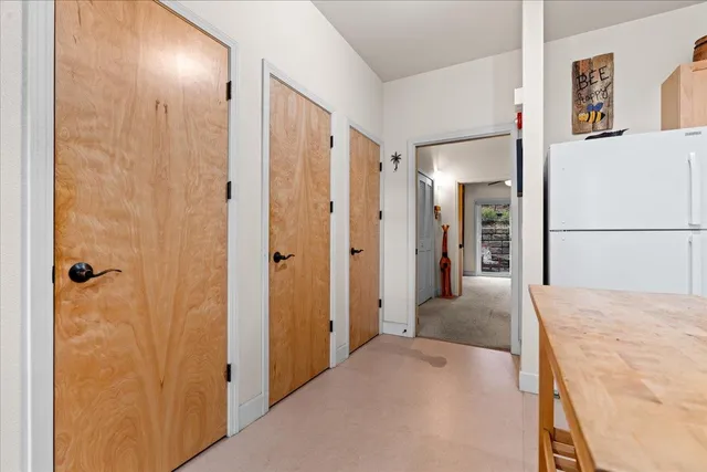 a view of a hallway with two rooms