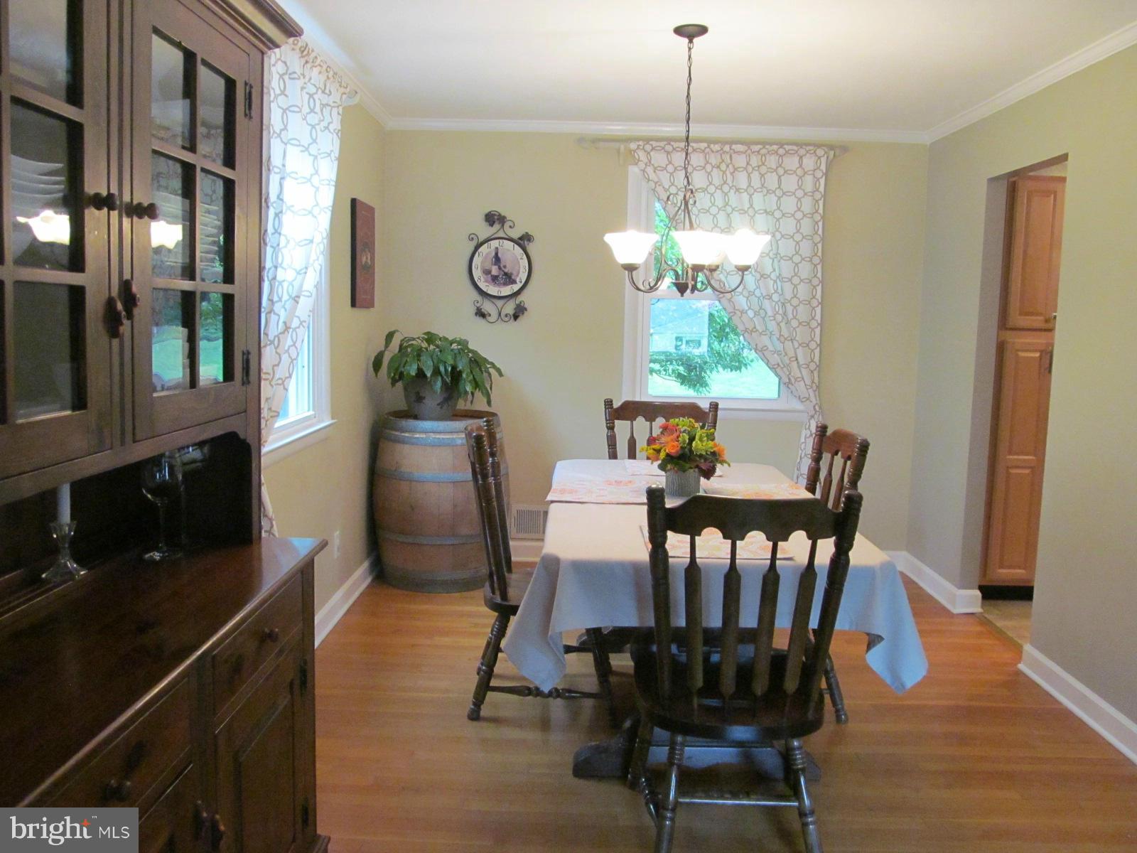 331 Stonewall Road Baltimore, MD 21228 - Photo 11 of 24 Formal Dining area with exposed H/W floors