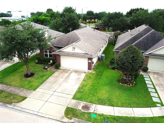 a aerial view of a house with a yard