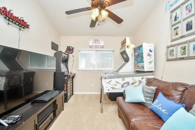 a living room with furniture and a window