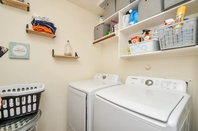 a utility room with dryer and washer