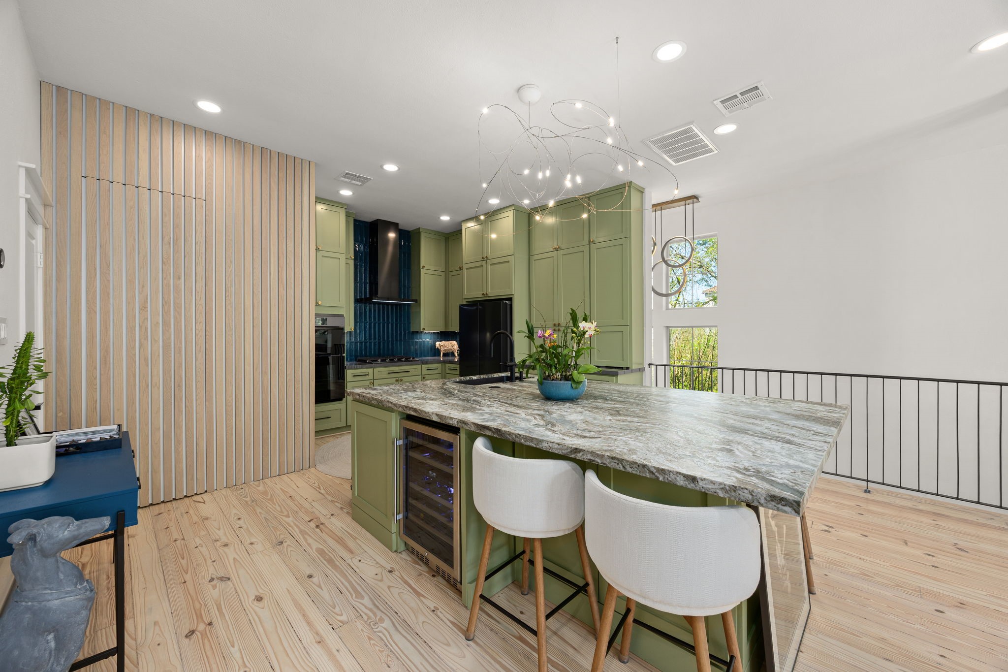 523 Fowler Street Houston, TX 77007 - Photo 12 of 39 a kitchen with a table chairs sink and wooden floor