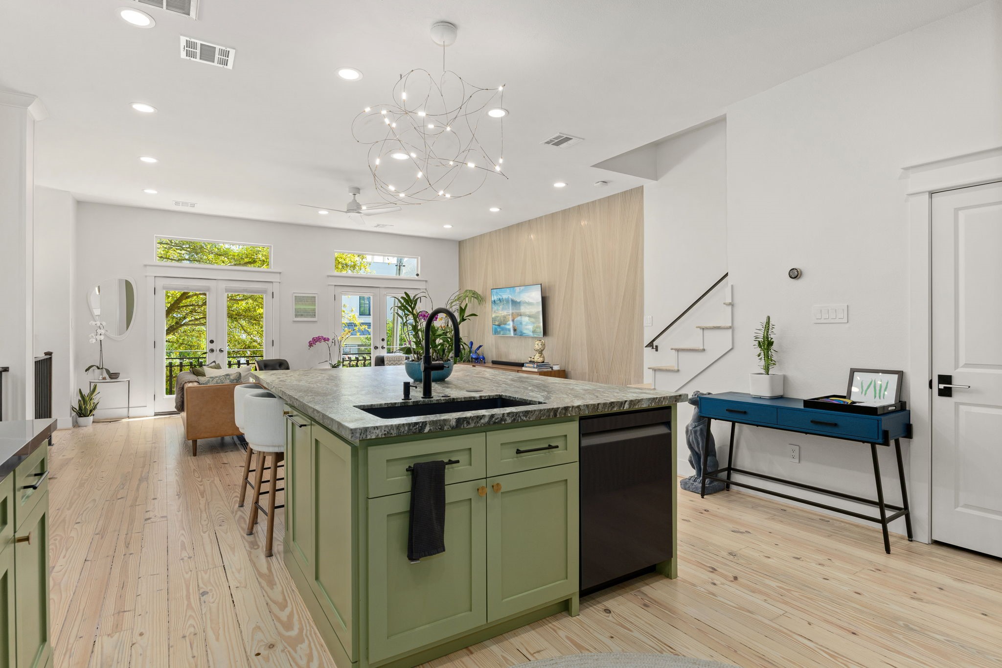 523 Fowler Street Houston, TX 77007 - Photo 13 of 39 a kitchen with stainless steel appliances granite countertop a stove and a wooden floors
