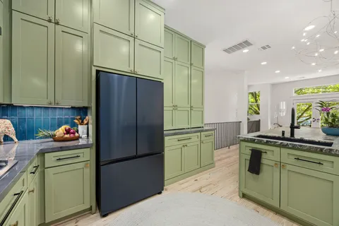 a view of entryway with wooden floor and stairs