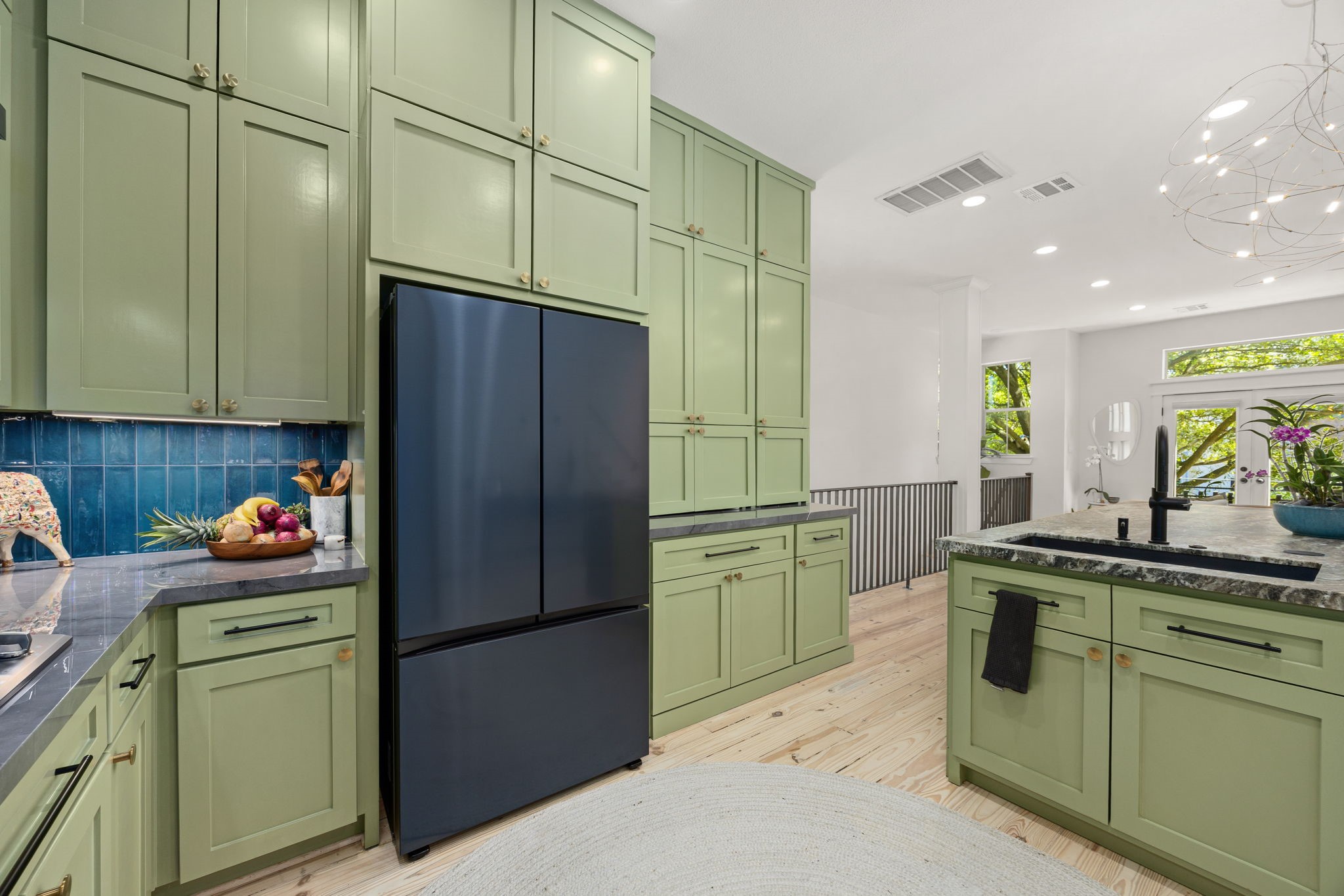 523 Fowler Street Houston, TX 77007 - Photo 17 of 39 a kitchen with a refrigerator and a sink
