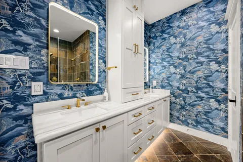 a bathroom with a tub and a shower