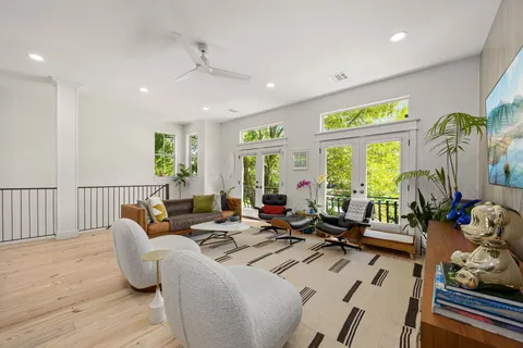 a living room with furniture and a large window