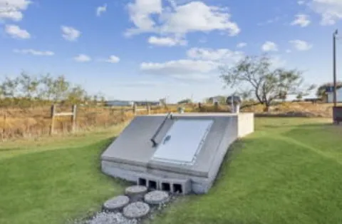 a view of a couches in patio and a yard