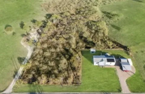 view of a yard with brick wall