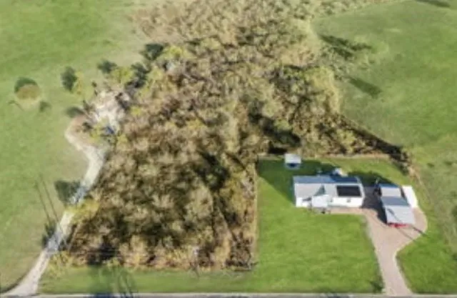 view of a yard with brick wall