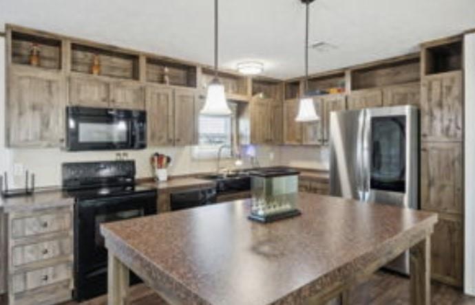 10240 Norrell Road Venus, TX 76084 - Photo 5 of 19 a kitchen with stainless steel appliances granite countertop a sink a stove and a refrigerator