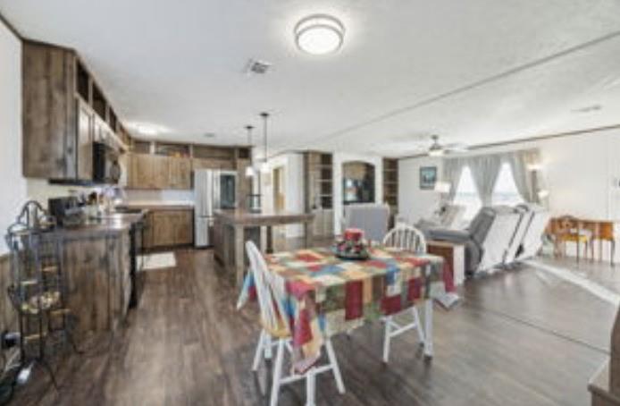 10240 Norrell Road Venus, TX 76084 - Photo 6 of 19 a view of a dining room with furniture and wooden floor