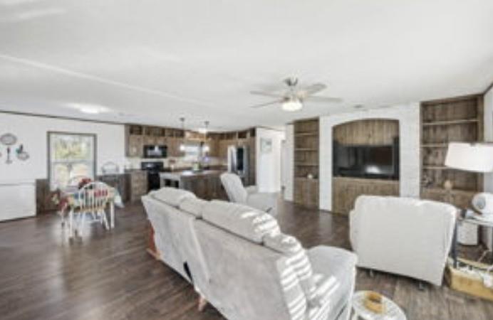10240 Norrell Road Venus, TX 76084 - Photo 7 of 19 a living room with furniture and a flat screen tv