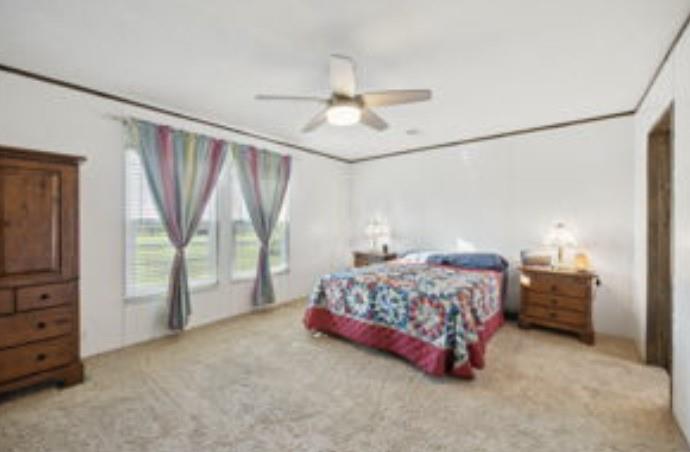 10240 Norrell Road Venus, TX 76084 - Photo 9 of 19 a bedroom with a bed and a large window