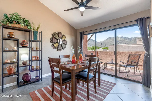 a view of a dining room with furniture window and outside view