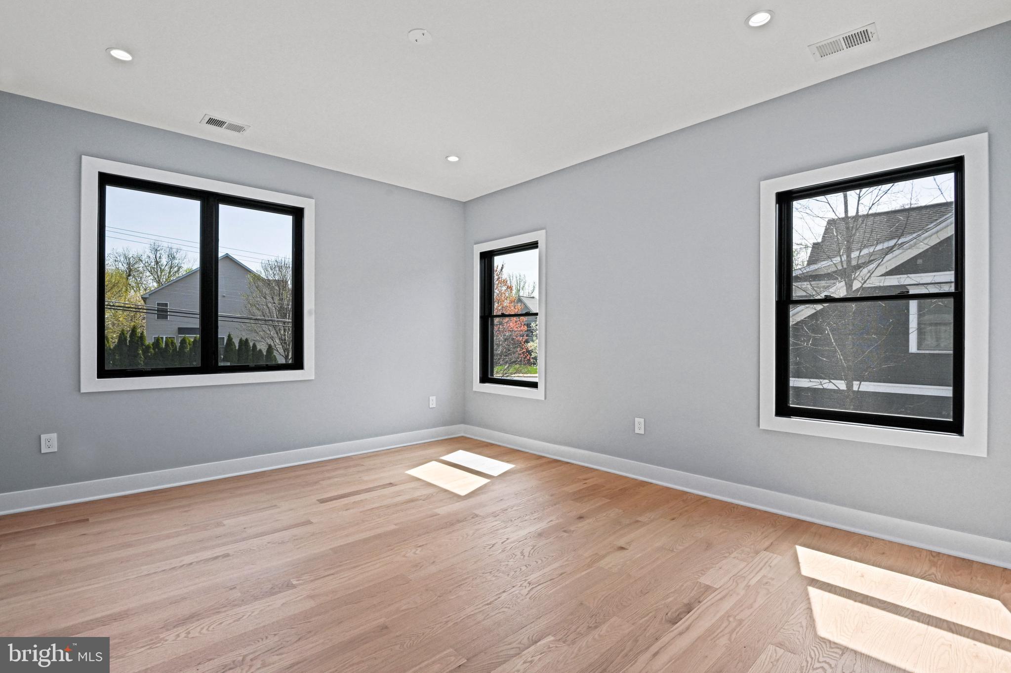 1052 Balls Hill Road McLean, VA 22101 - Photo 40 of 64 a view of an empty room with wooden floor and a window