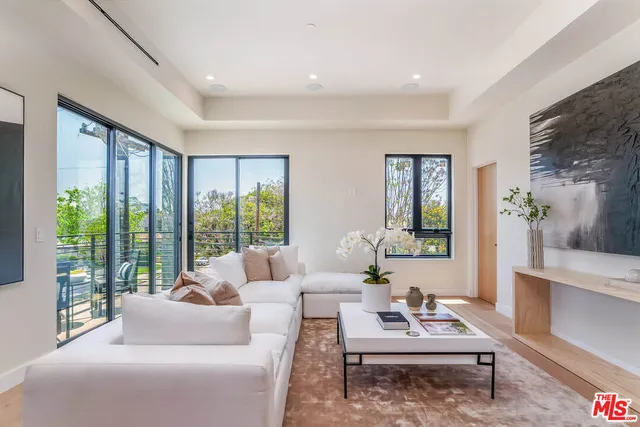 a kitchen with stainless steel appliances kitchen island granite countertop a table chairs stove a sink and dishwasher