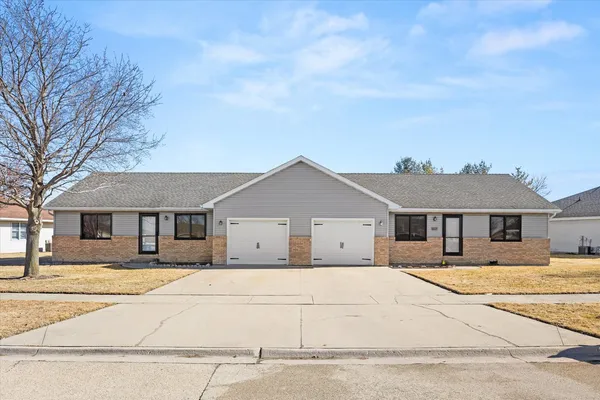 a front view of a house with a outdoor space