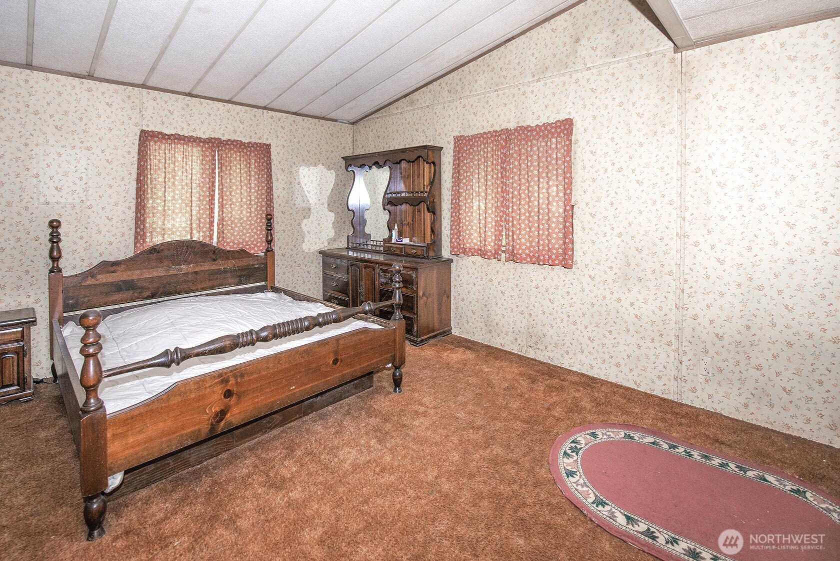 20115 49th Drive Southeast Bothell, WA 98012 - Photo 22 of 35 a spacious bedroom with a bed and wooden floor