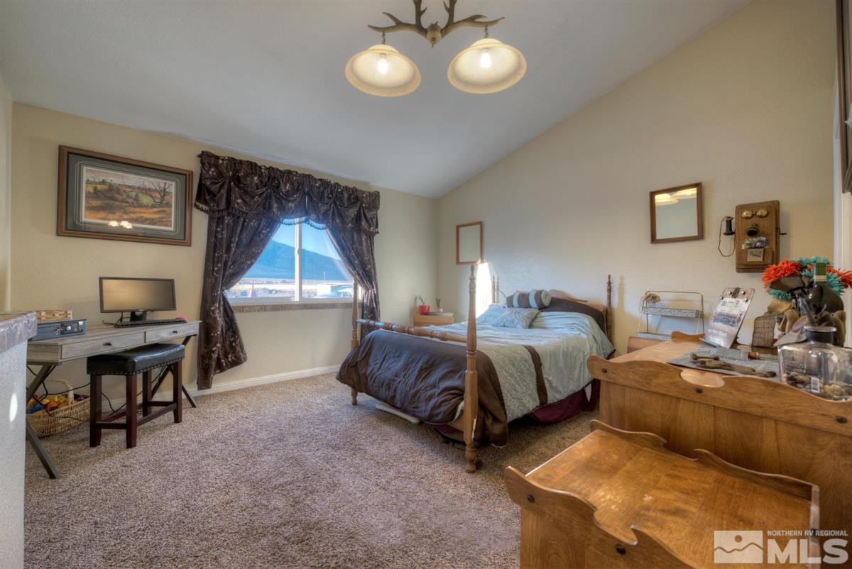 2160 Antelope Valley Road Reno, NV 89506 - Photo 14 of 25 a spacious bedroom with two beds and a desk