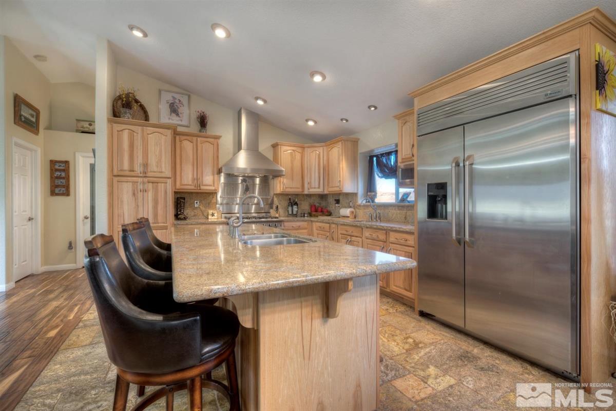 2160 Antelope Valley Road Reno, NV 89506 - Photo 4 of 25 a kitchen with stainless steel appliances granite countertop a sink and a refrigerator