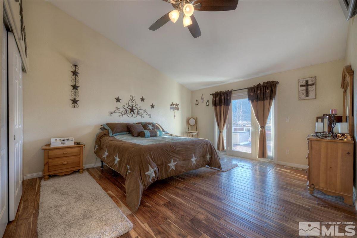 2160 Antelope Valley Road Reno, NV 89506 - Photo 6 of 25 a bedroom with a bed and wooden floor