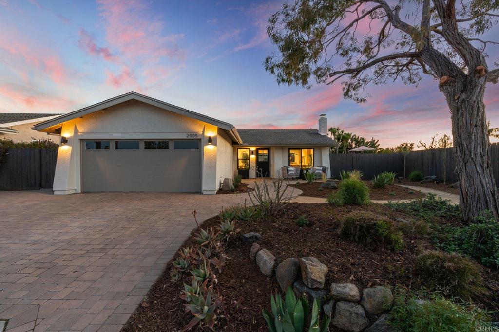 2005 Shadow Grove Way Encinitas, CA 92024 - Photo 1 of 1 a front view of a house with a yard and garage