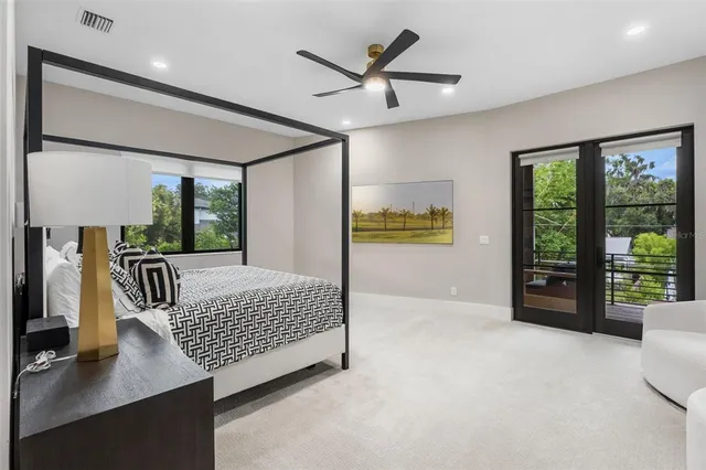a view of a balcony with chairs and wooden floor