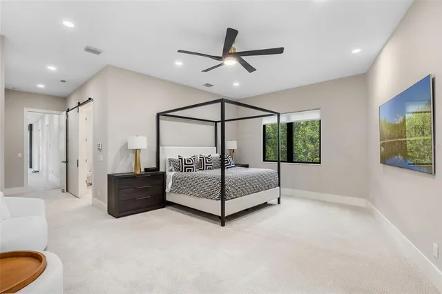 a view of a patio with couches chairs and a potted plant