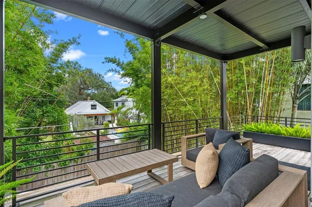 a bedroom with a bed window and a flat screen tv