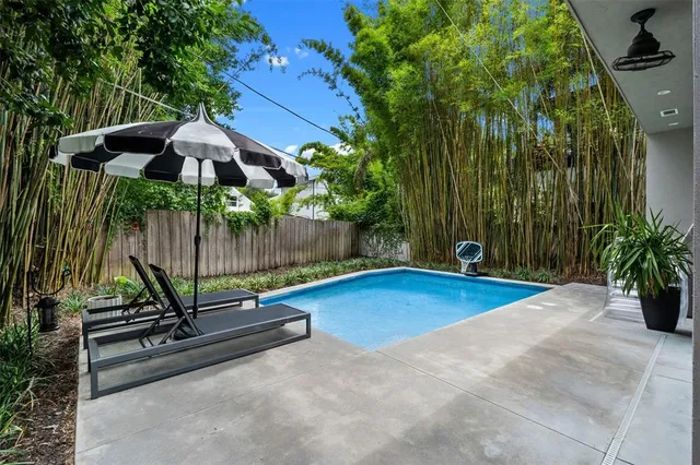 an aerial view of a house with a garden