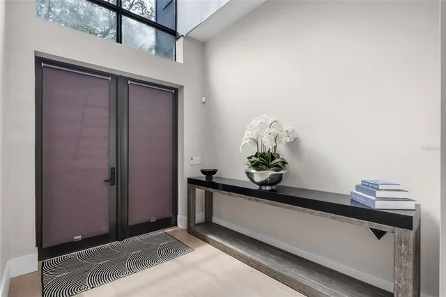 a kitchen with center island table and chairs
