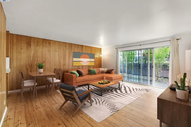 a outdoor living space with furniture and wooden floor