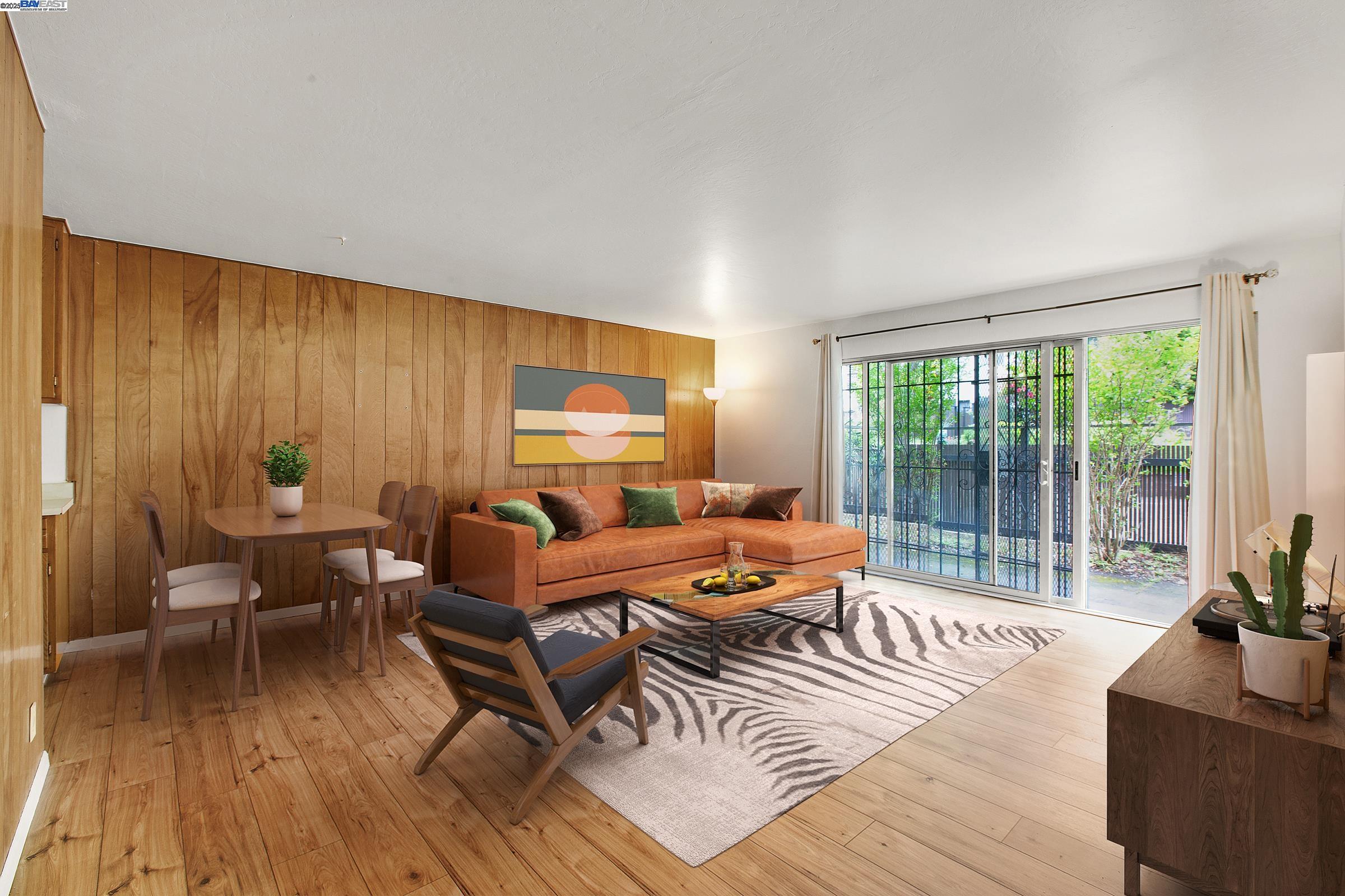 a outdoor living space with furniture and wooden floor