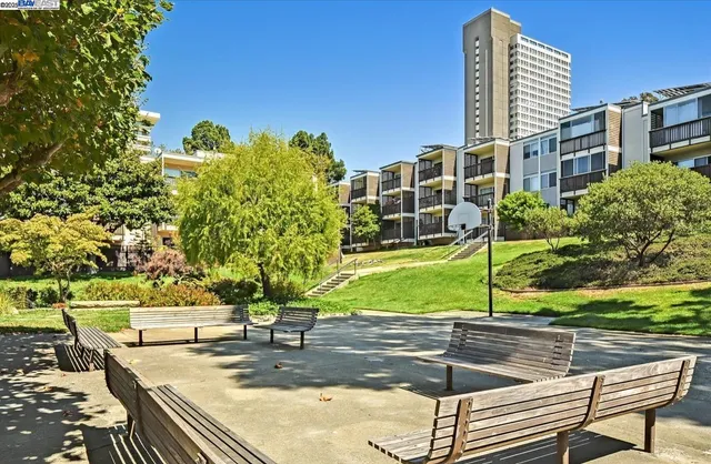 a view of a patio with a table and chairs