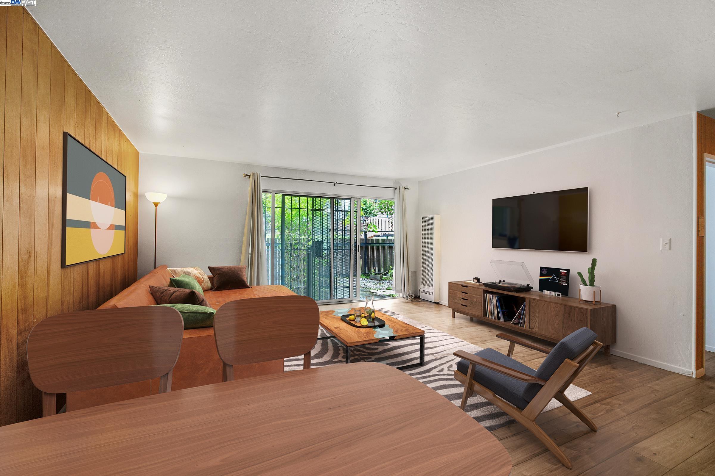 1540 O'Farrell Street, Unit 1 San Francisco, CA 94115 - Photo 2 of 19 a living room with furniture window and a flat screen tv