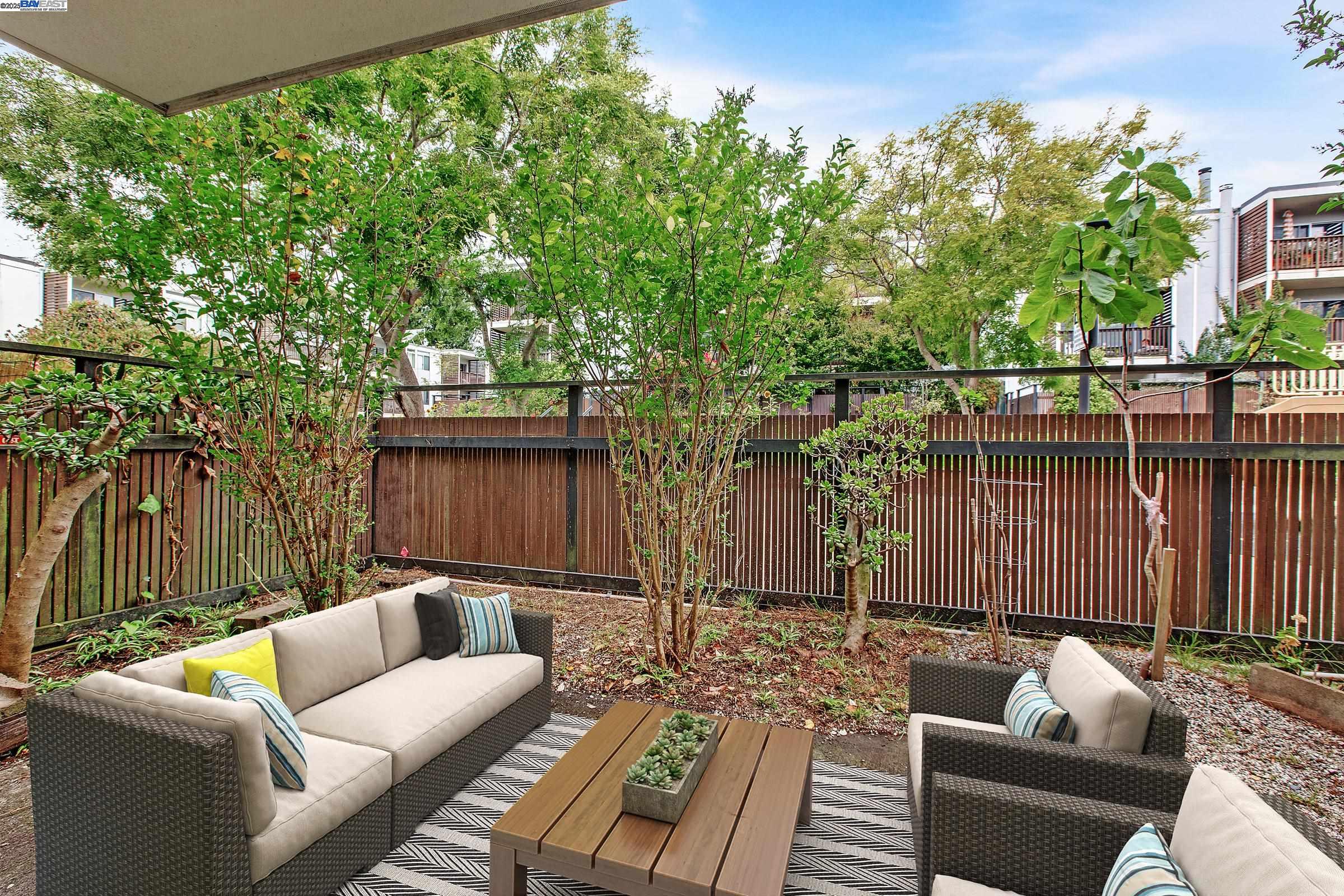 1540 O'Farrell Street, Unit 1 San Francisco, CA 94115 - Photo 4 of 19 a view of a patio with couches chairs and wooden floor
