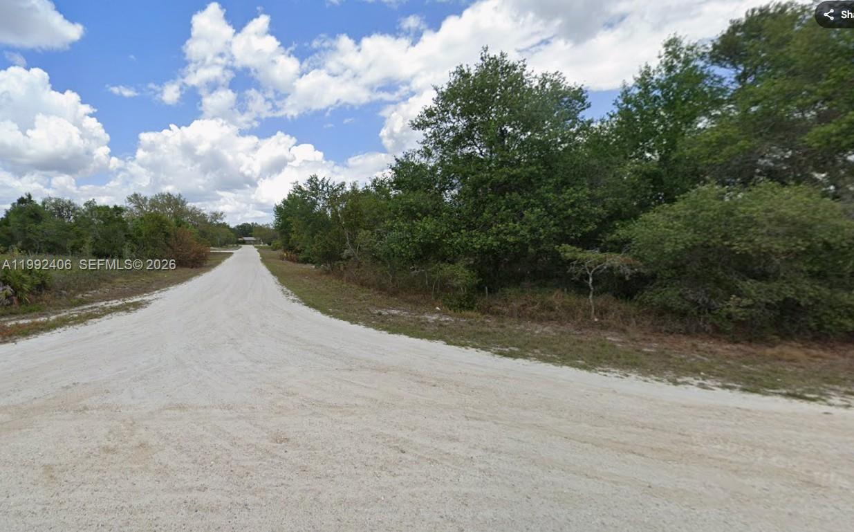 240 North Madera Road Avon Park, FL 33825 - Photo 5 of 5 a view of a lake with mountain in the background